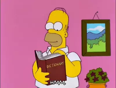 Homer Simpson looking at a dictionary.