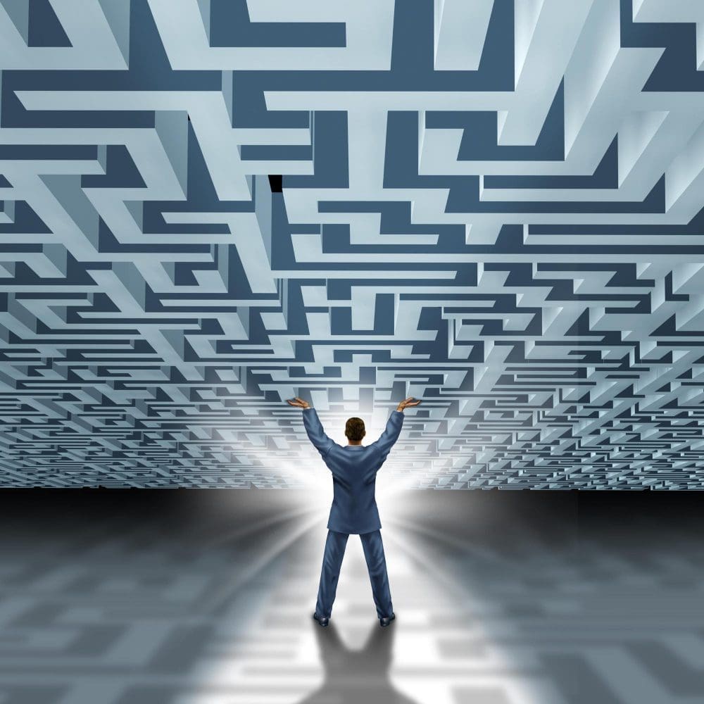 A businessman standing in front of a labyrinth, symbolizing the meaning and definition of local digital marketing.